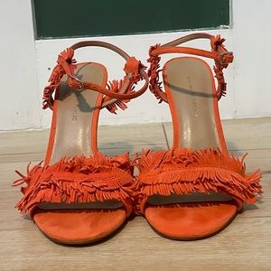 Vibrant orange suede heel sandal.